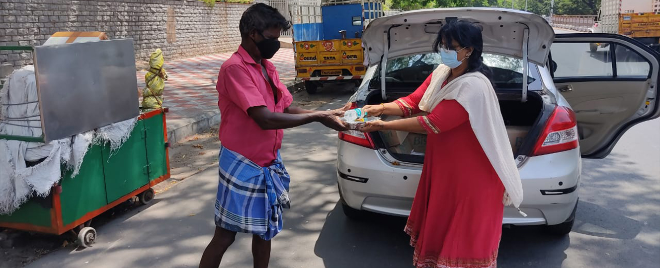 Distributing essentials to a sanitation worker